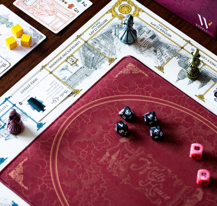 The board in Molly House, roll the pink dice and walk the streets of London with your metal player pawn!